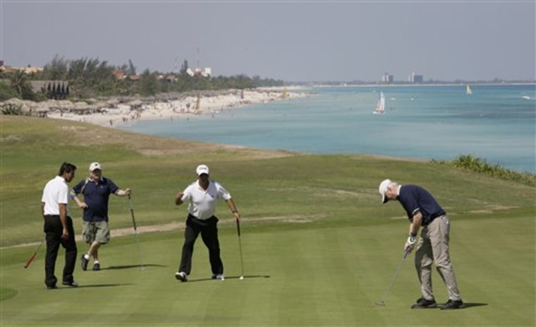 Golfers use a practice area during the Montecristo Cup Golf Tournament in Varadero, Cuba, in April.